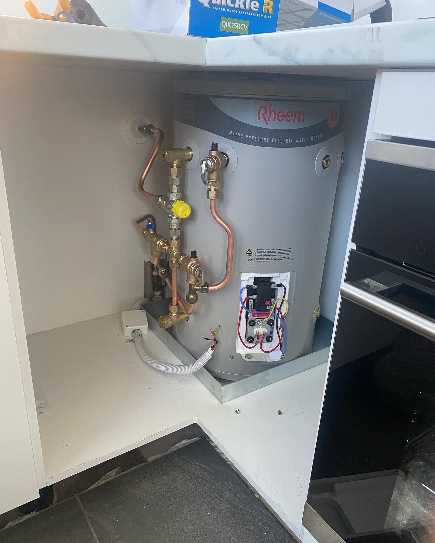 Rheem Water Heater in a Cabinet — C’s Plumbing & Gas Gold Coast in Brisbane, QLD