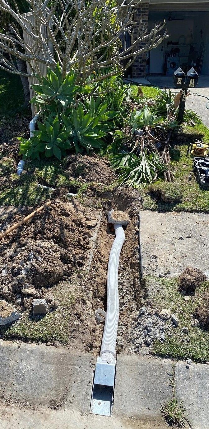 Trench With Gray Conduit Extending — C’s Plumbing & Gas Gold Coast in Brisbane, QLD