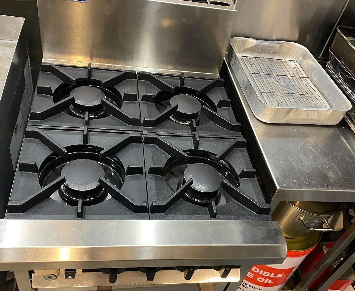 Close-up of a Gas Stove Top — C’s Plumbing & Gas Gold Coast in Logan, QLD