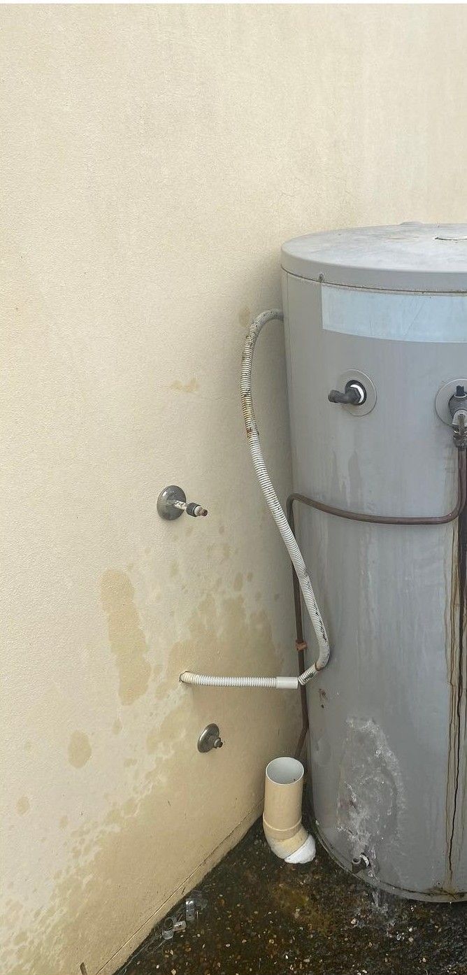 Water Heater in a Corner Next to a Wall — C’s Plumbing & Gas Gold Coast in Logan, QLD