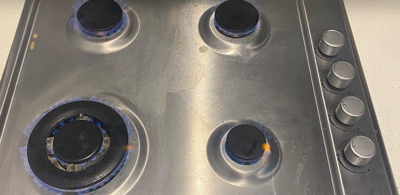 Stainless Steel Gas Stovetop With Four Burners — C’s Plumbing & Gas Gold Coast in Yatala, QLD