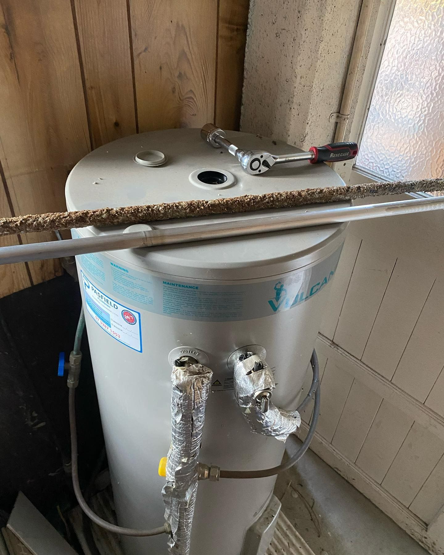 Water Heater With Pipes and a Wrench on Top — C’s Plumbing & Gas Gold Coast in Yatala, QLD