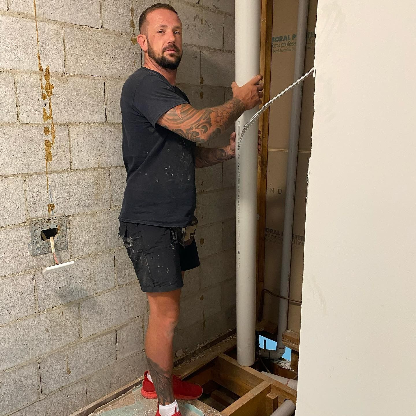 Man With Tattoos Works on Plumbing — C’s Plumbing & Gas Gold Coast in Yatala, QLD
