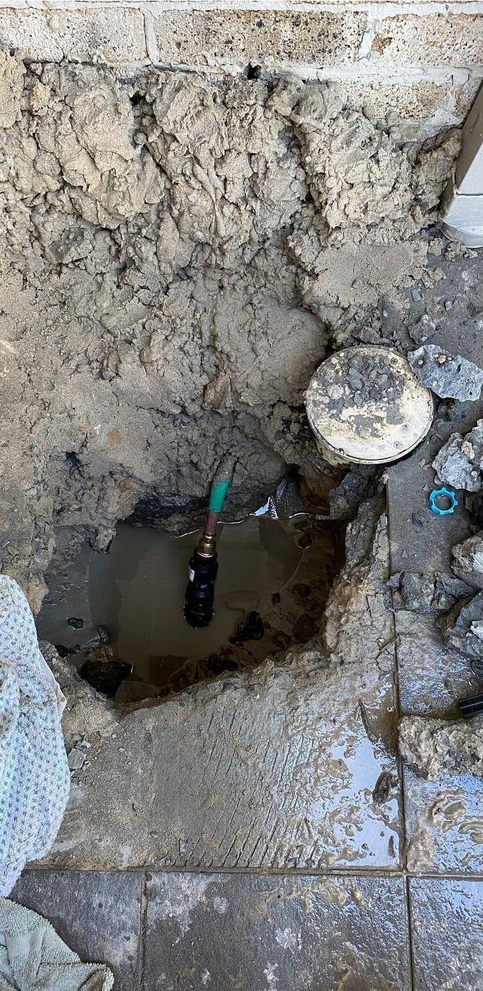 Hole in the Floor Reveals Plumbing Fixtures — C’s Plumbing & Gas Gold Coast in Yatala, QLD