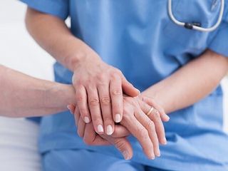 Nurse Holding Patient Hand — Intravenous Immunoglobulin Therapy in Westchester, CA