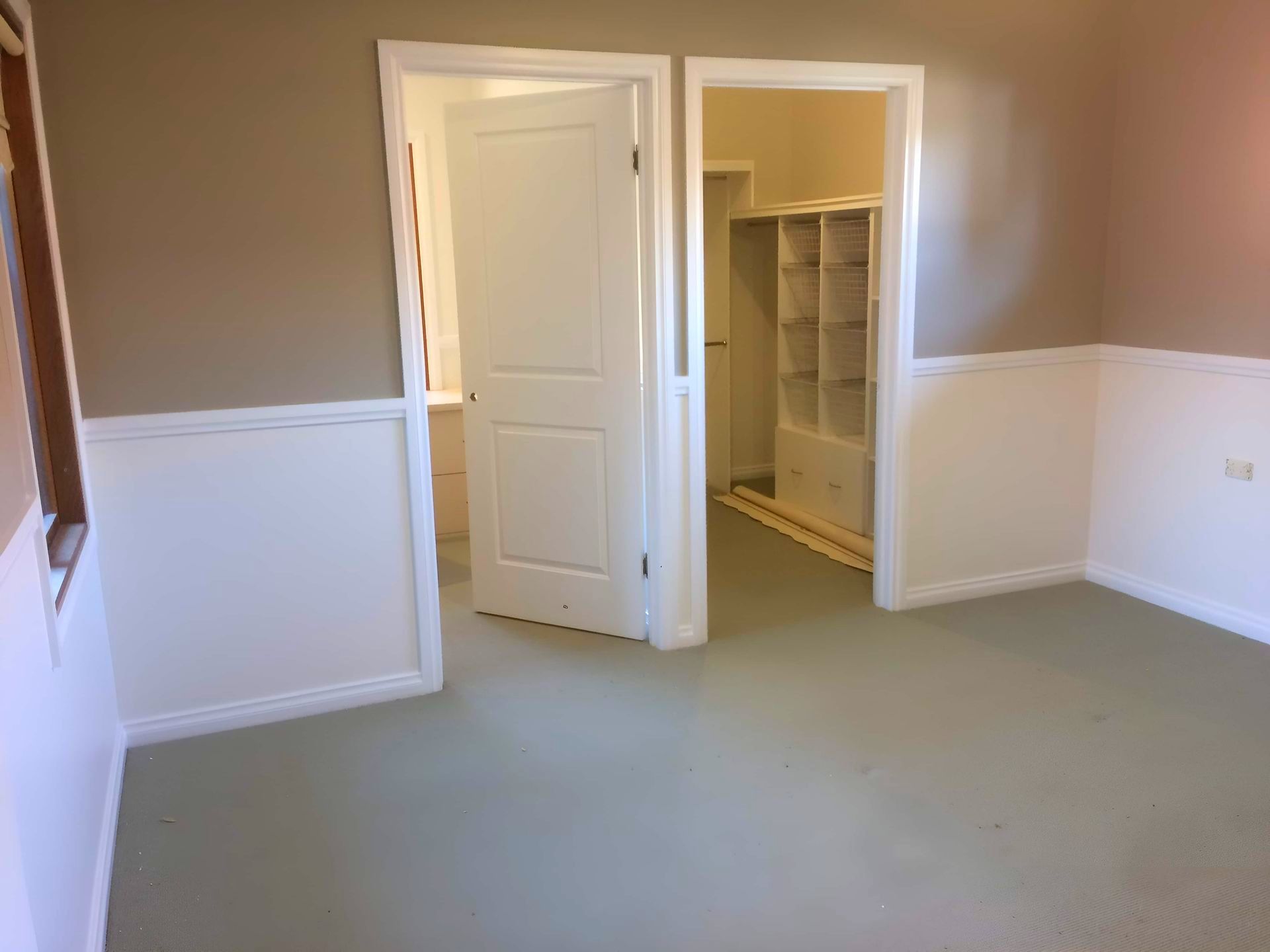An Empty Room With A Walk In Closet And A Window — Recoat Painting In West Wodonga, VIC
