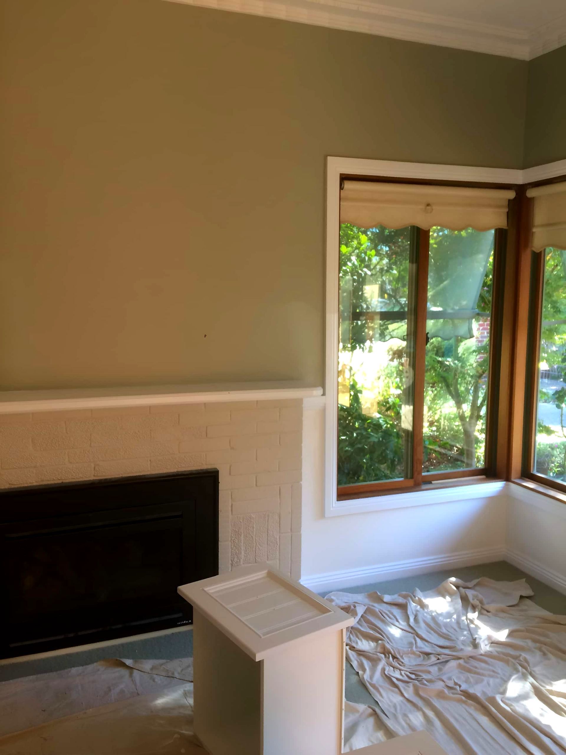 A Living Room With A Fireplace And Lots Of Windows — Recoat Painting In West Wodonga, VIC