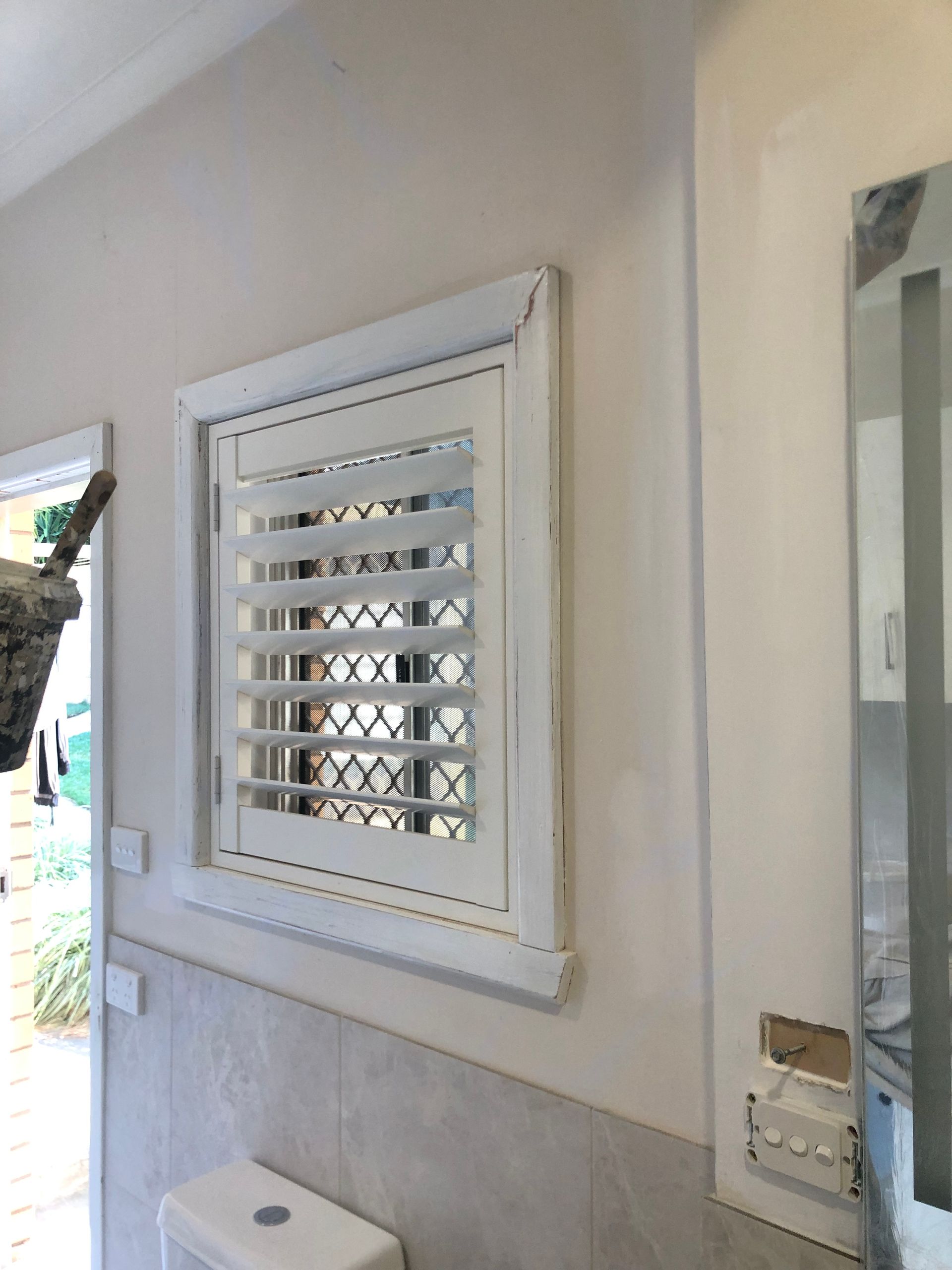 A Kitchen With A Brick Wall And A Window — Recoat Painting In West Wodonga, VIC