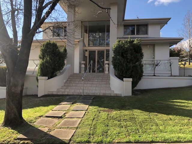 A large white house with a tree in front of it — Recoat Painting In West Wodonga, VIC