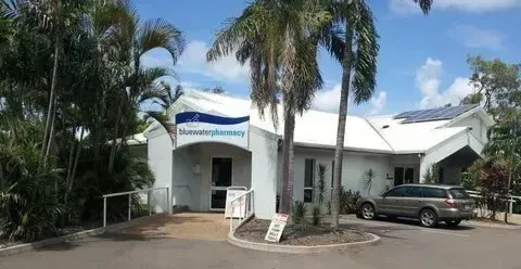 A White Building With a Car Parked in Front of It — Bluewater Pharmacy in Yabulu, QLD