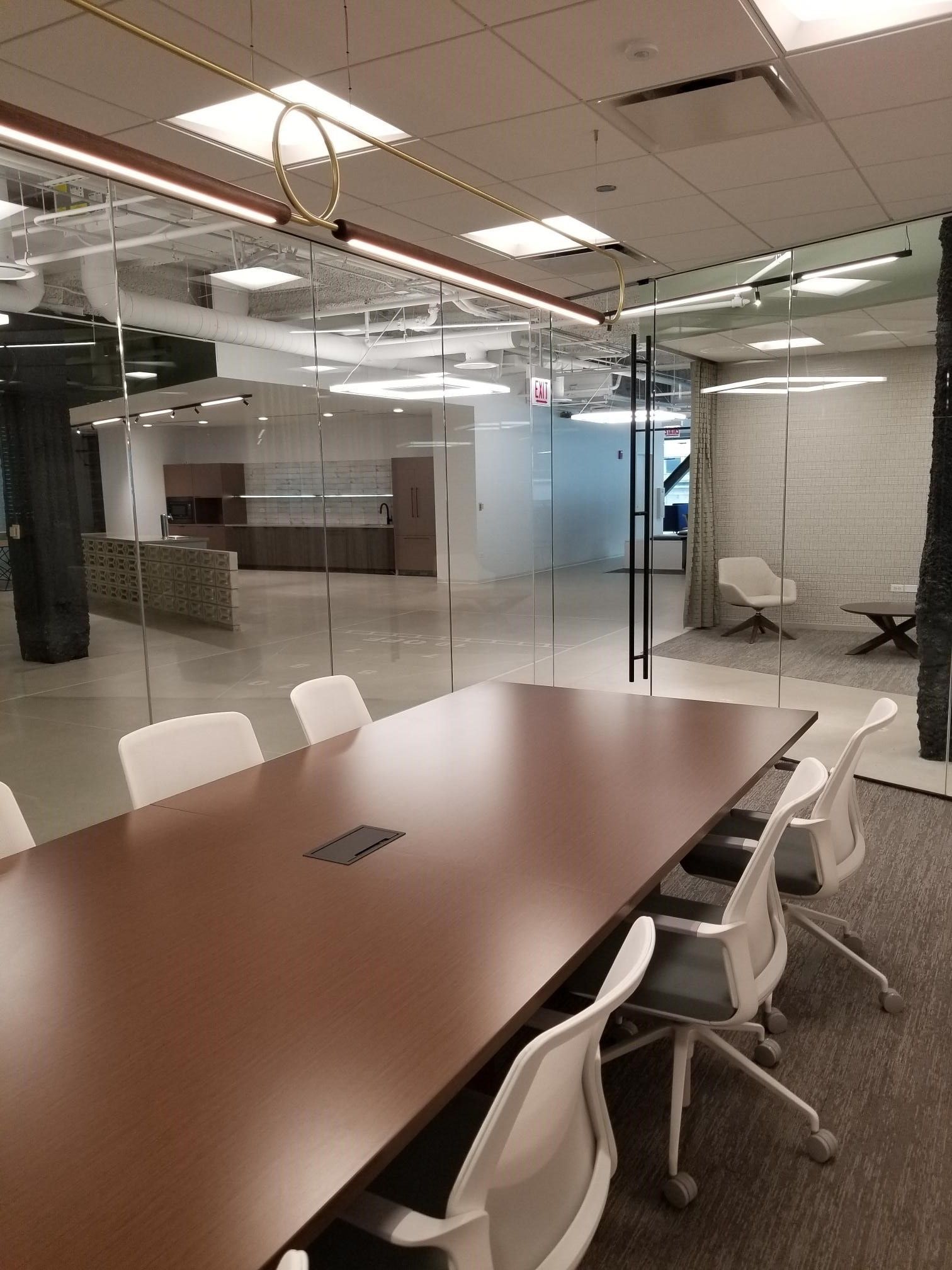 A conference room with a long table and chairs