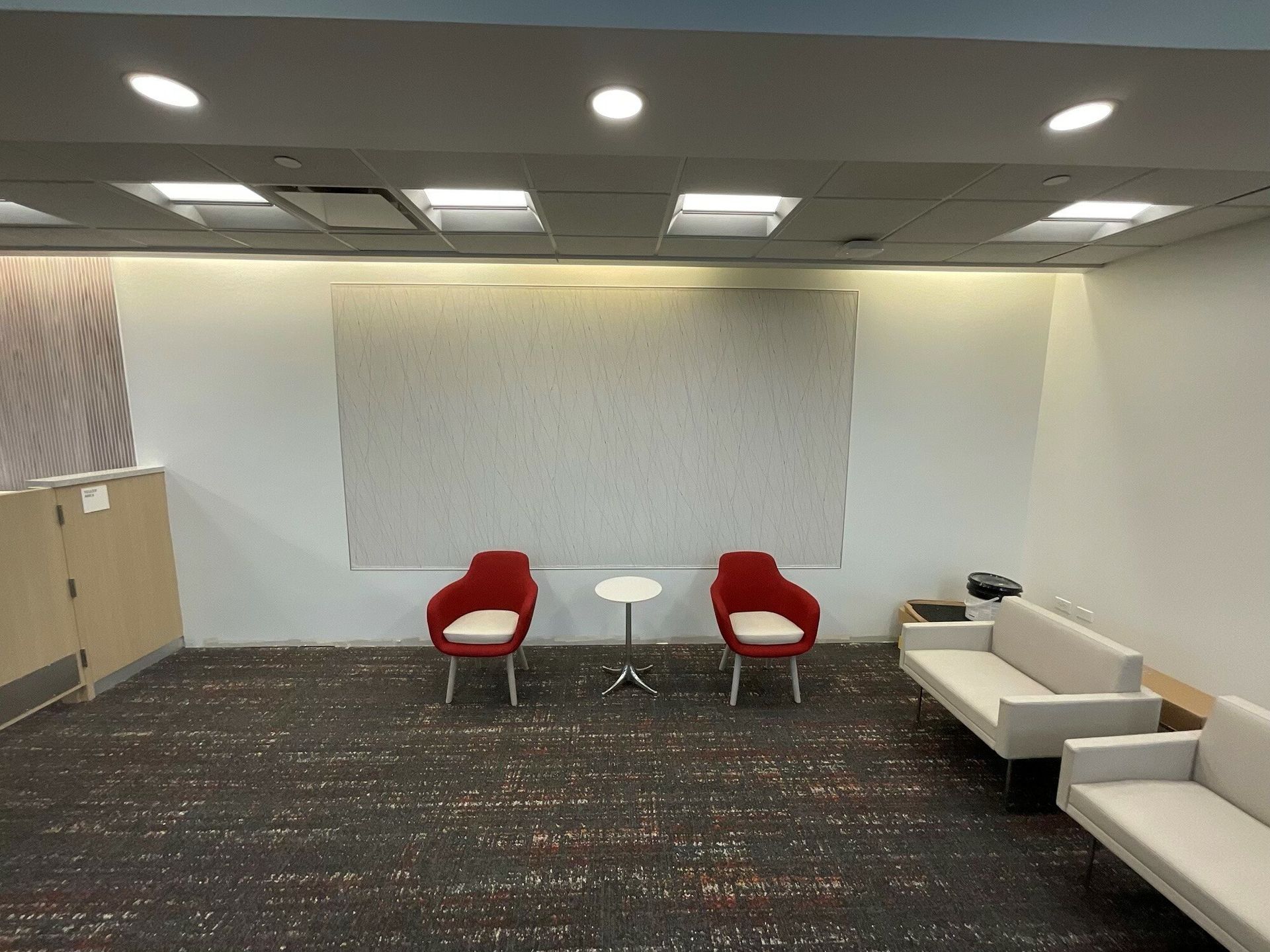 There are two chairs and a couch in the room.