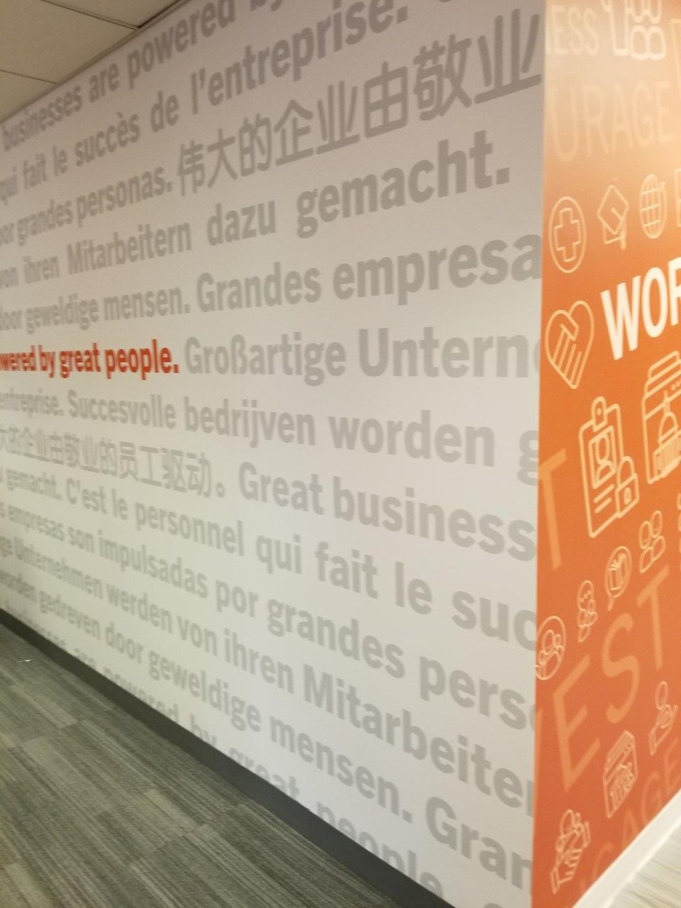 A wall that has a lot of words on it