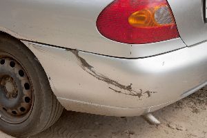 Grey car with damaged bumper — Waipahu, HI — Westside Fender/Body & Refinishing