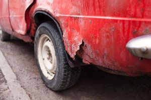 Dirty and broken red car — Waipahu, HI — Westside Fender/Body & Refinishing