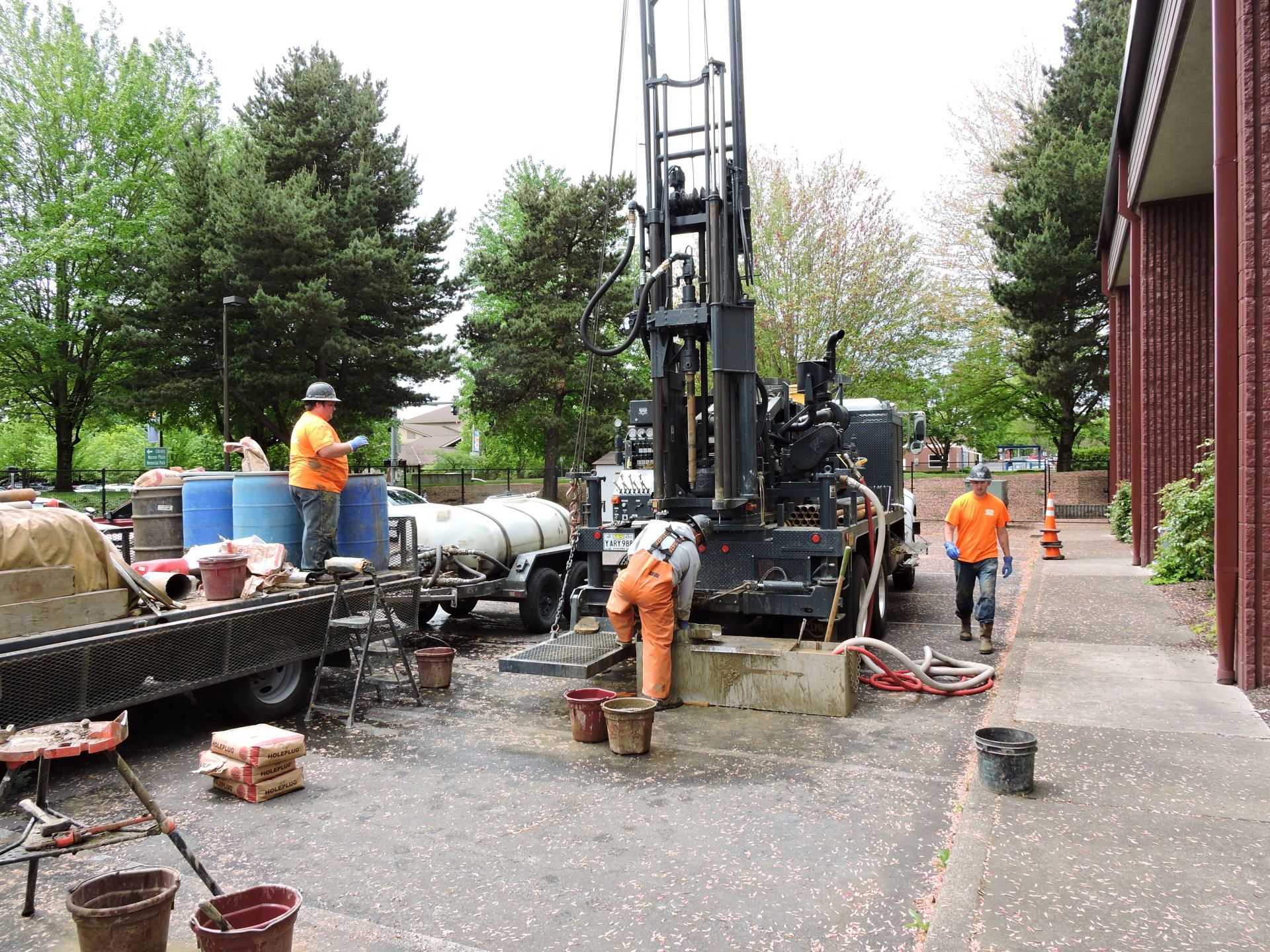 Water Drilling Services  — Men Hanging with Their Equipment in Hubbard, OR