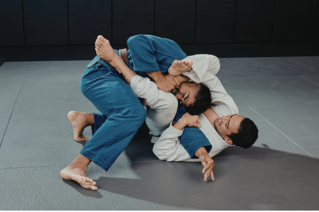 Adult students rolling in Jiu-Jitsu at Almighty Jiu-Jitsu in Huntington Beach, CA.