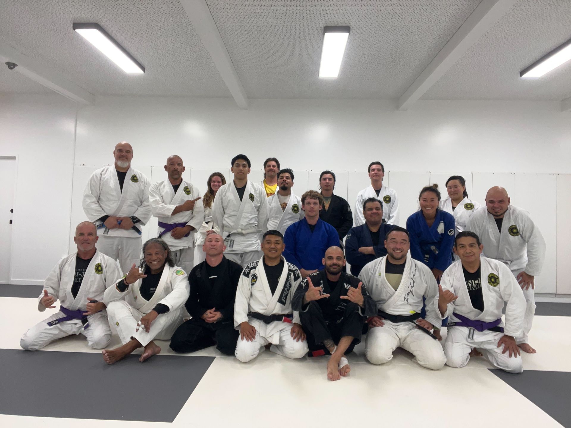 Partners drill Jiu-Jitsu technique at Almighty Jiu-Jitsu in Huntington Beach, CA, building balance.