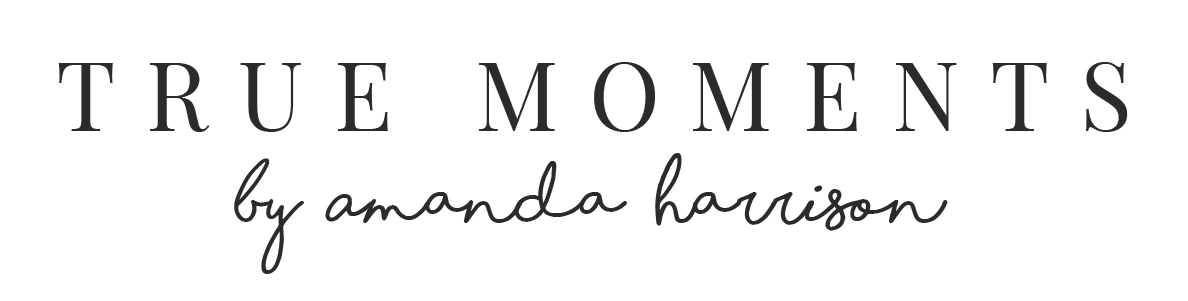 “TRUE MOMENTS” logo in serif text with “by amanda harrison” in cursive below on a white background