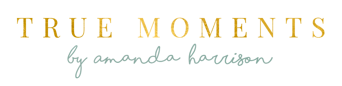 “True Moments” logo in gold and script, with “by amanda harrison” in light gray on a white background