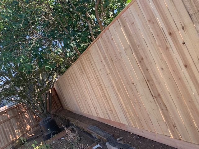 Hardwood fencing for backyard privacy and landscaping in Salem, OR residential property

