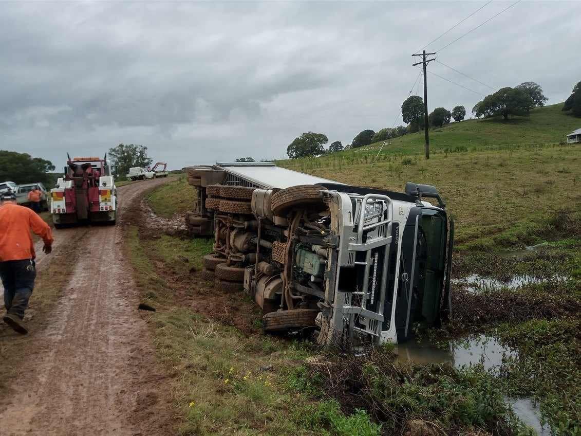 Overturned Semi-truck in Muddy Ditch — Bangalow Towing in Bangalow, NSW