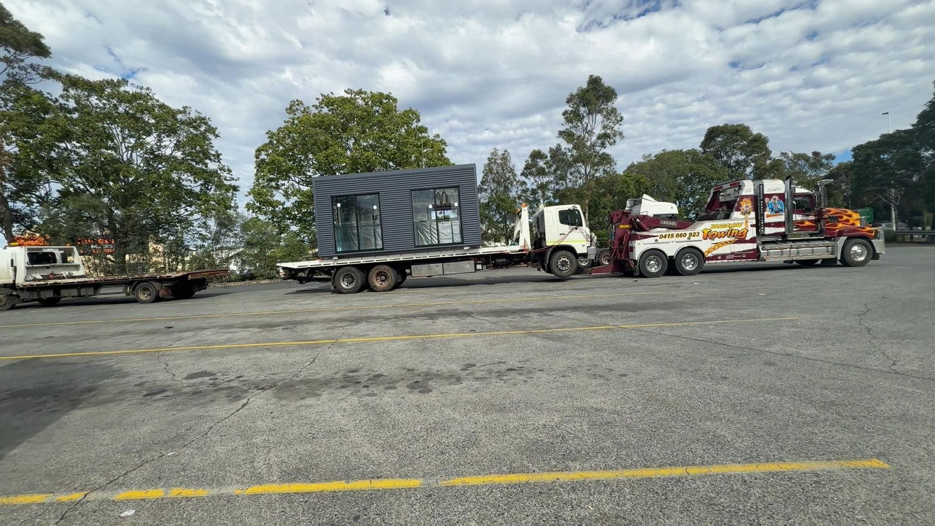 Three Tow Trucks on a Paved Lot — Bangalow Towing in Bangalow, NSW