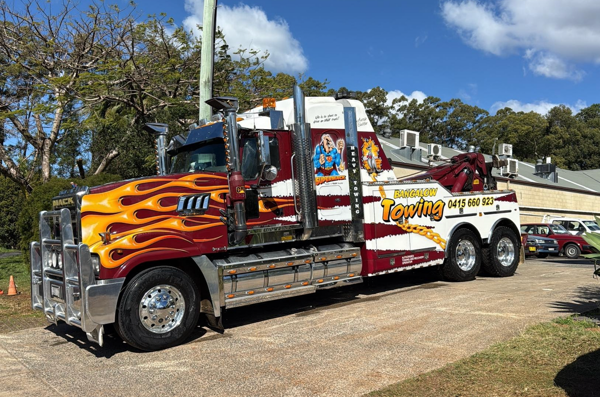 Colorful custom tow truck with flames and chrome parked outdoors — Bangalow Towing in Bangalow, NSW