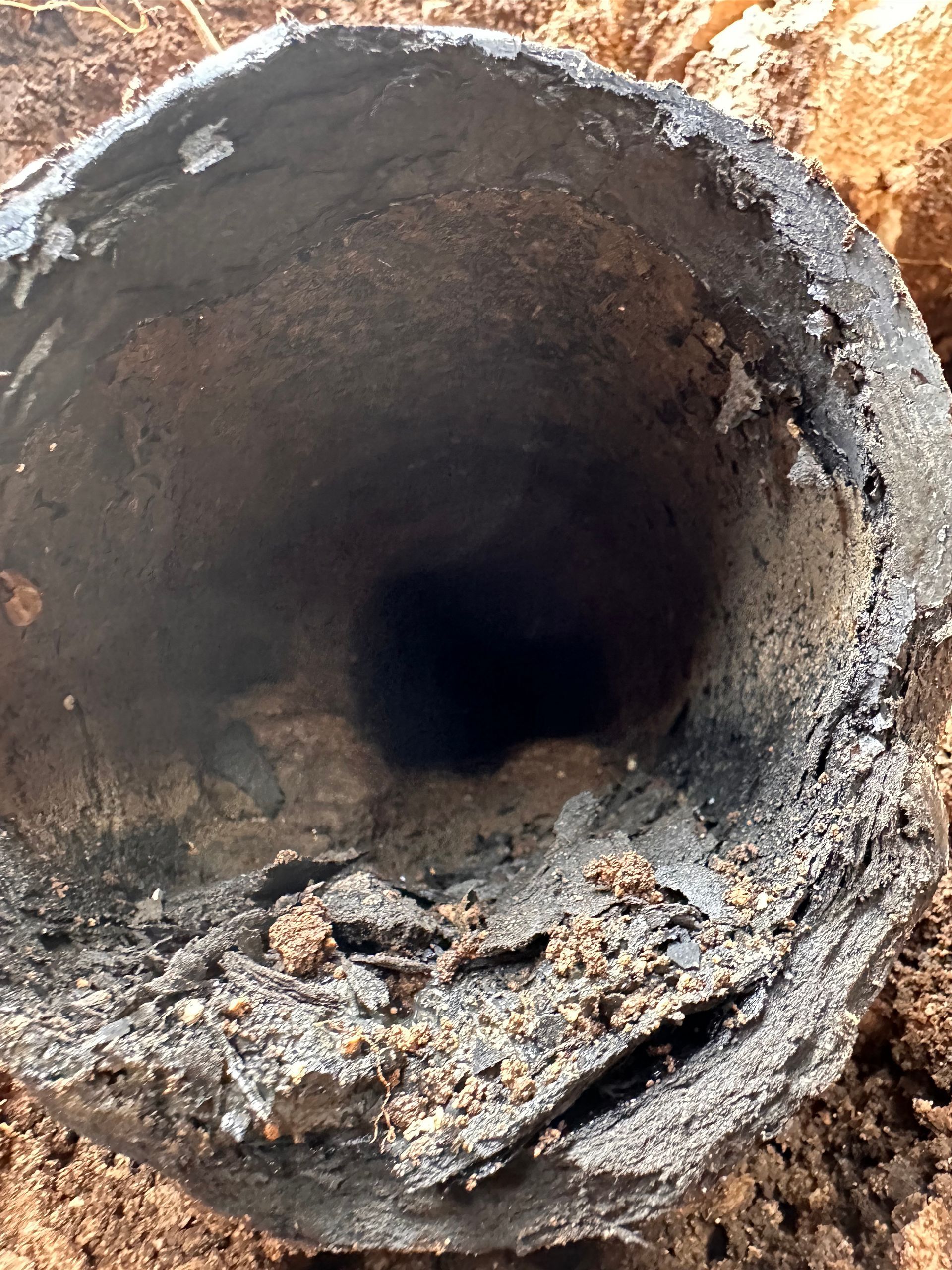 A close up of a large hole in the ground