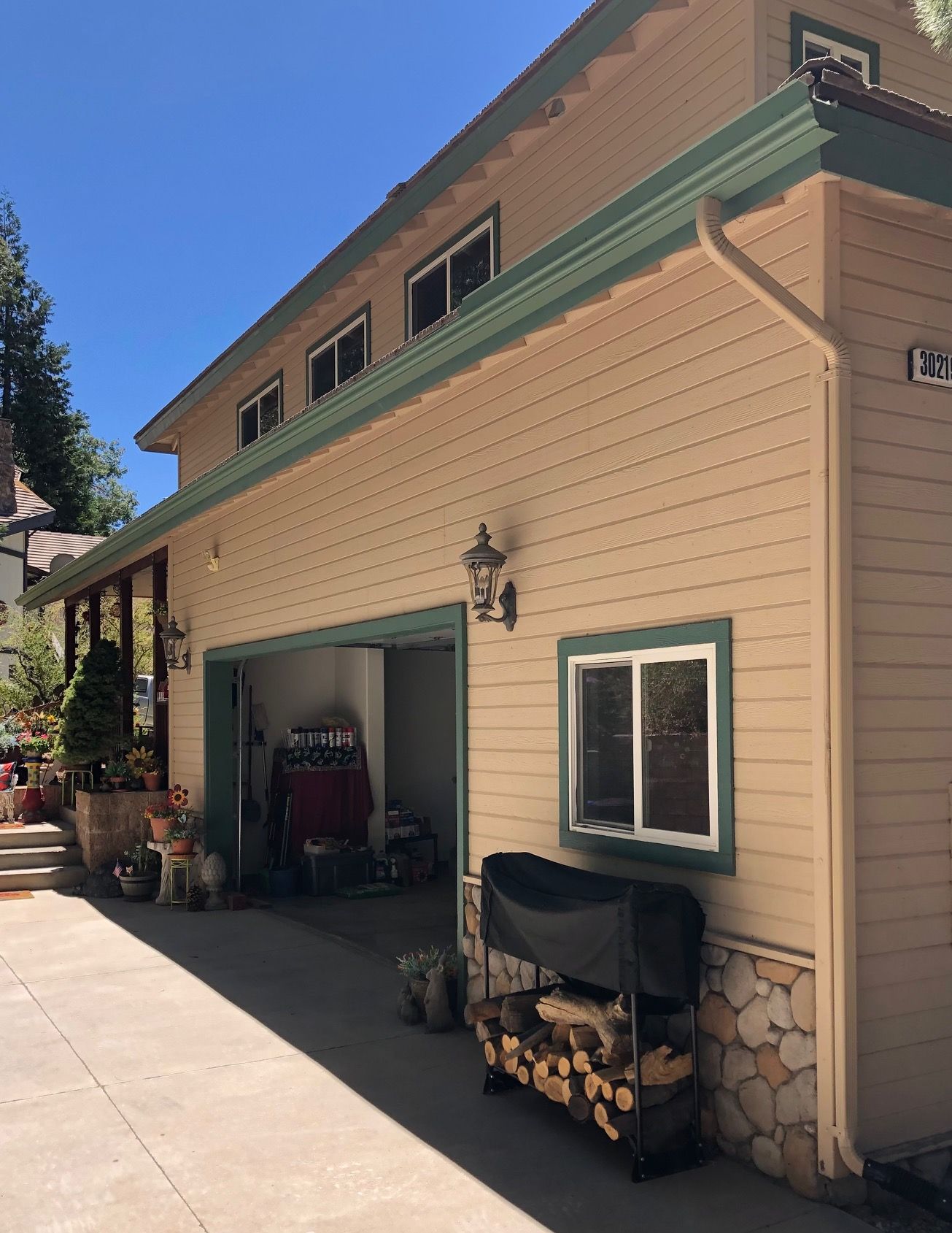 A large house with a garage and a lot of windows