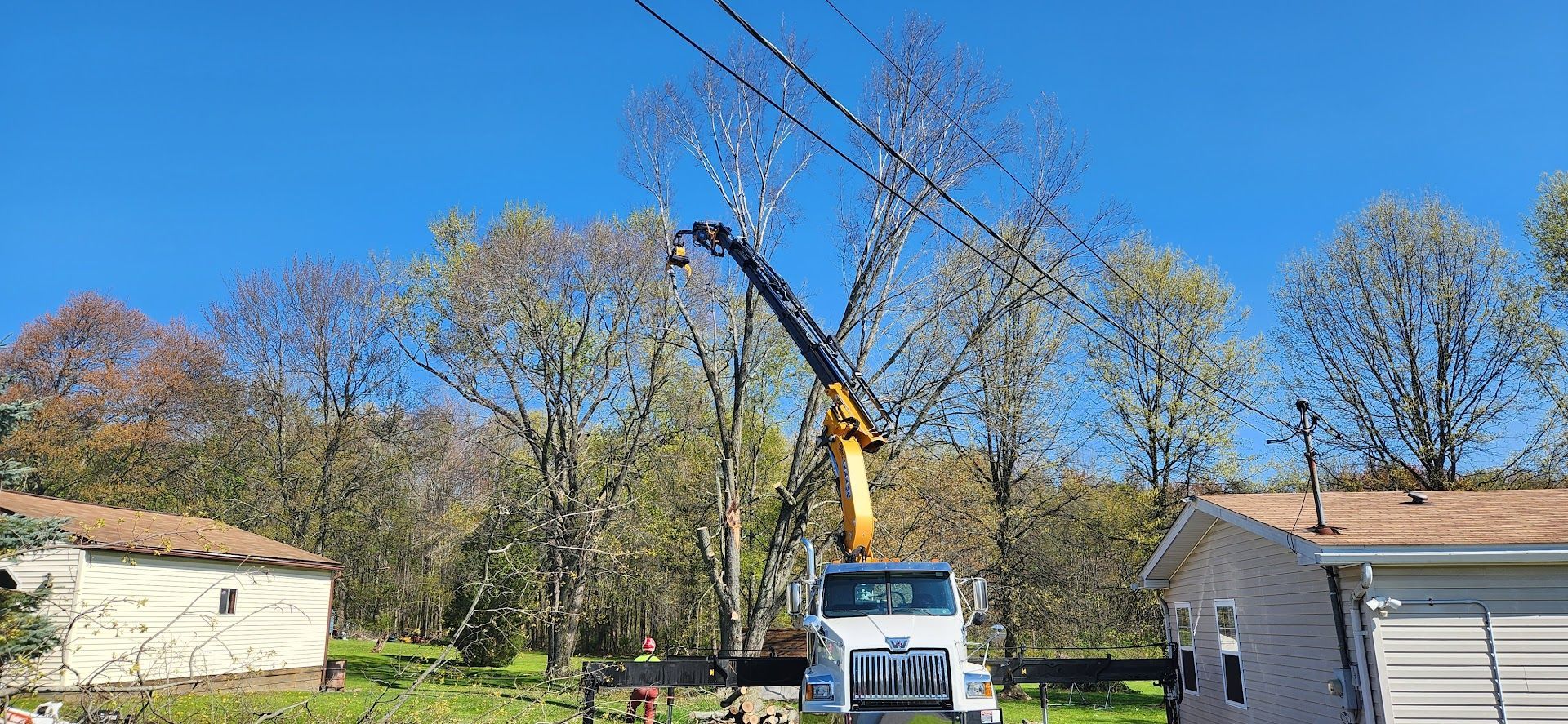 Crane Attached to It is Working on a Power Line — Masury, OH — Hackett's Tree Service