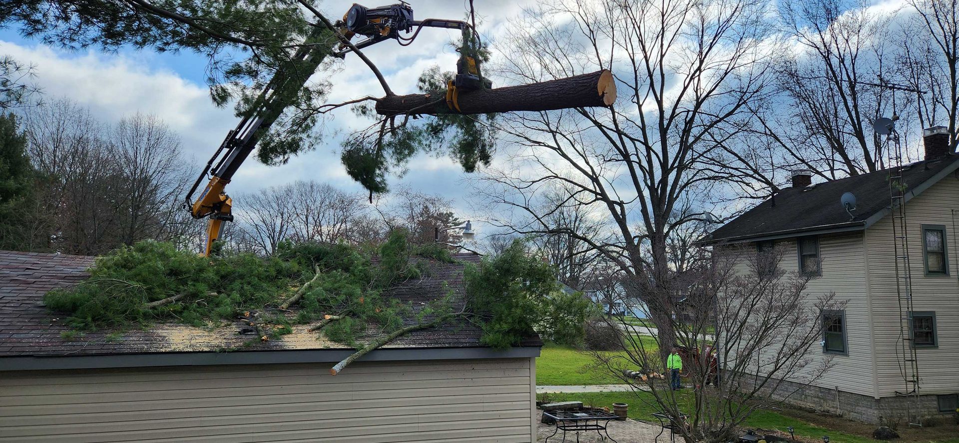 Tree is Being Cut Down by a Crane — Masury, OH — Hackett's Tree Service