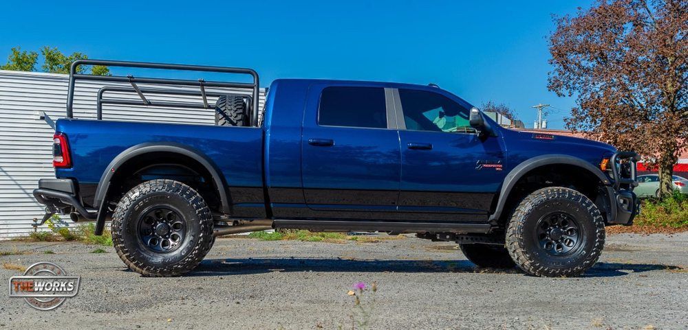 Vehicle with ceramic coating repels salt and grime in snowy Albany streets—winter protection.