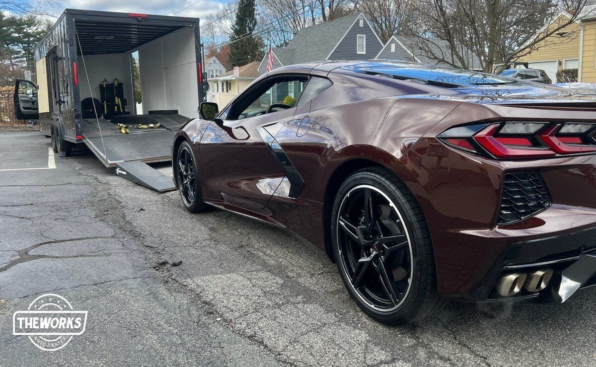 brown luxury car on the road