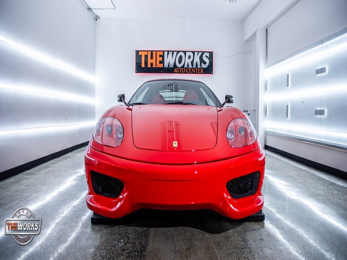 red car in the auto detail shop