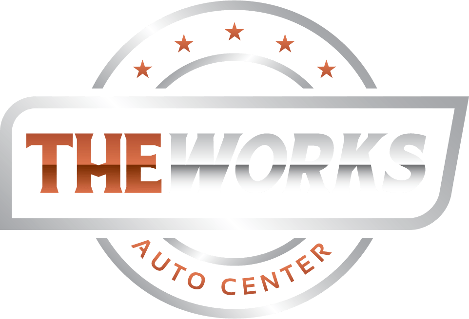 A logo for the works auto center is shown on a white background.