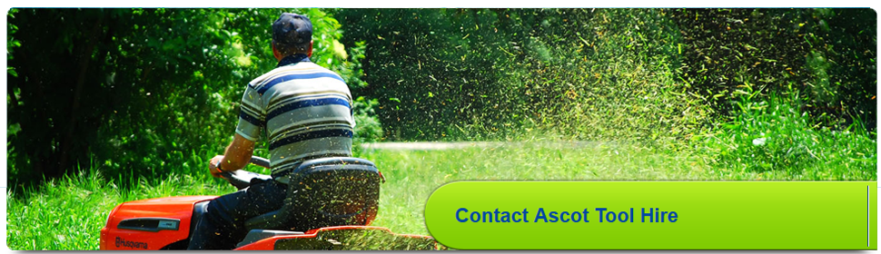  Man on a ride-on lawnmower cutting grass