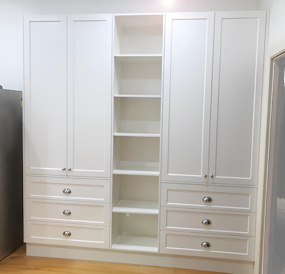 A White Wardrobe With Drawers and Shelves in a Room — BM Cabinetry In Spring Grove, NSW