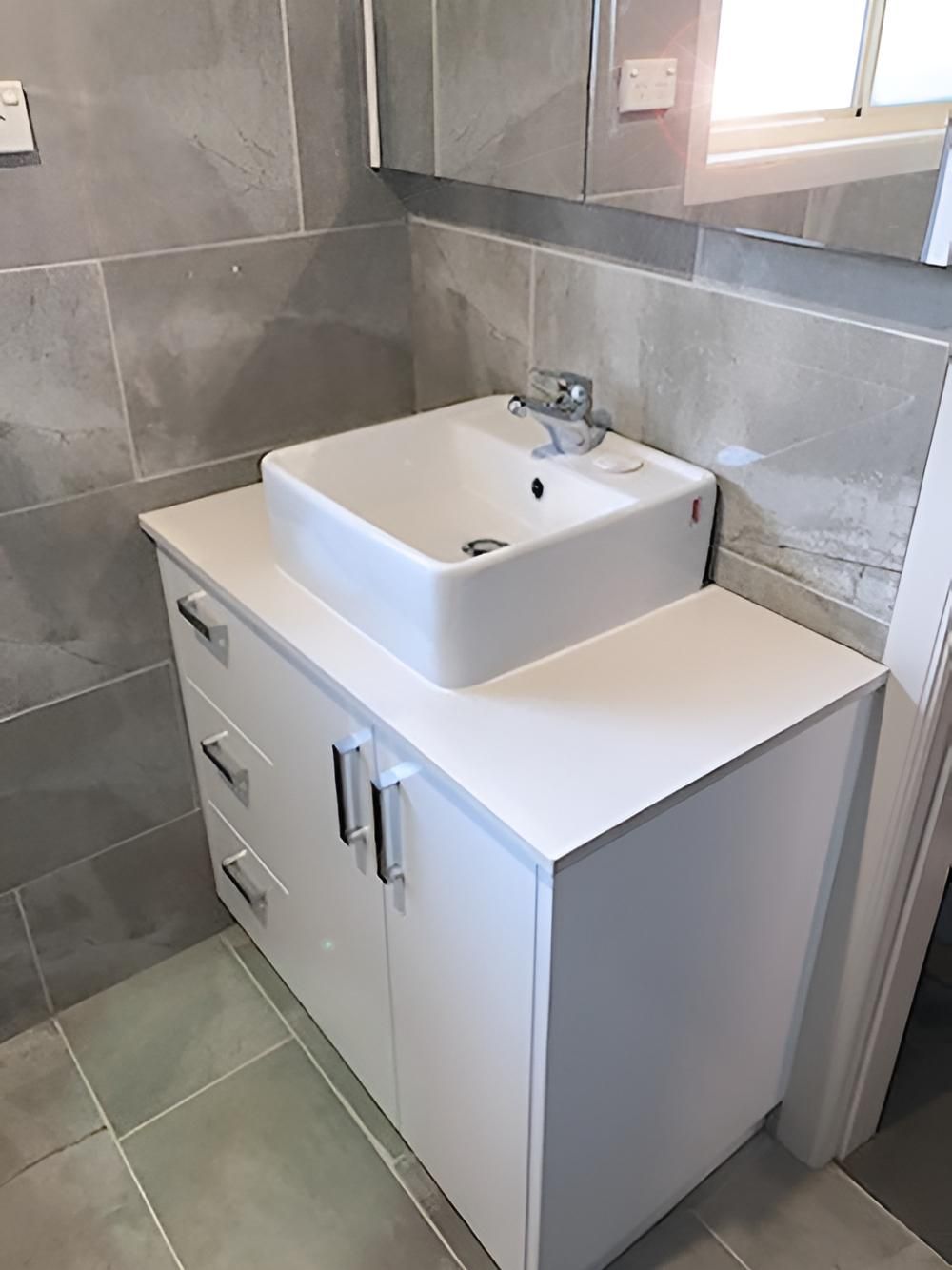 A Bathroom With a Sink and a Mirror on the Wall — BM Cabinetry In Spring Grove, NSW