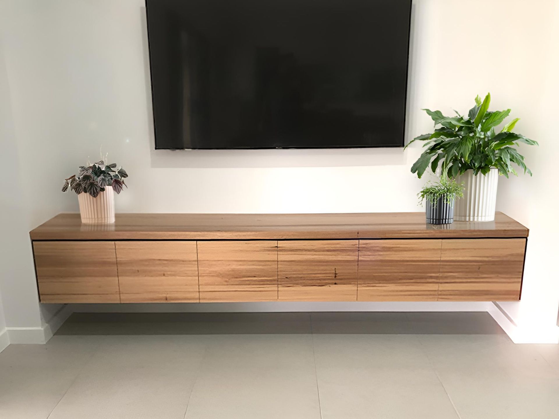 A Living Room With a Wooden Entertainment Center and a Flat Screen Tv — BM Cabinetry In Spring Grove, NSW