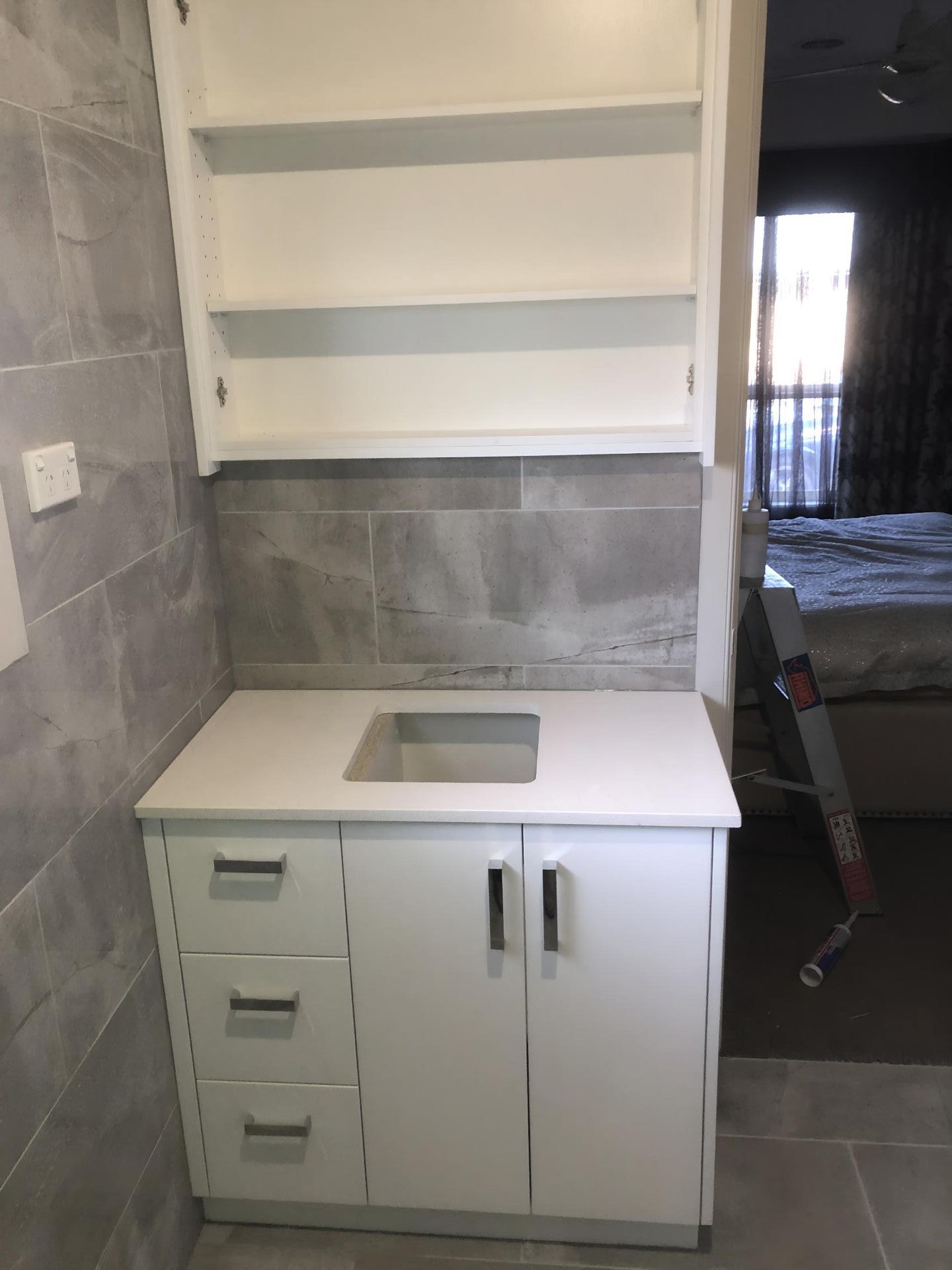 A Bathroom Vanity With a Sink , Drawers and Shelves — BM Cabinetry In Spring Grove, NSW