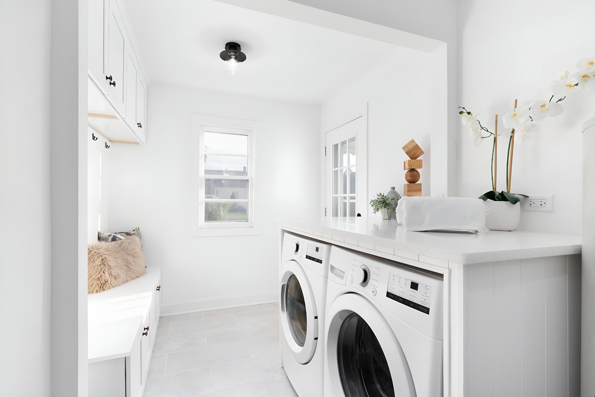 A Laundry Room With a Washer and Dryer in It — BM Cabinetry In Spring Grove, NSW
