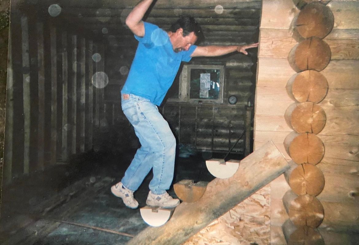 Rob Flynn doing the stairs on the log cabin