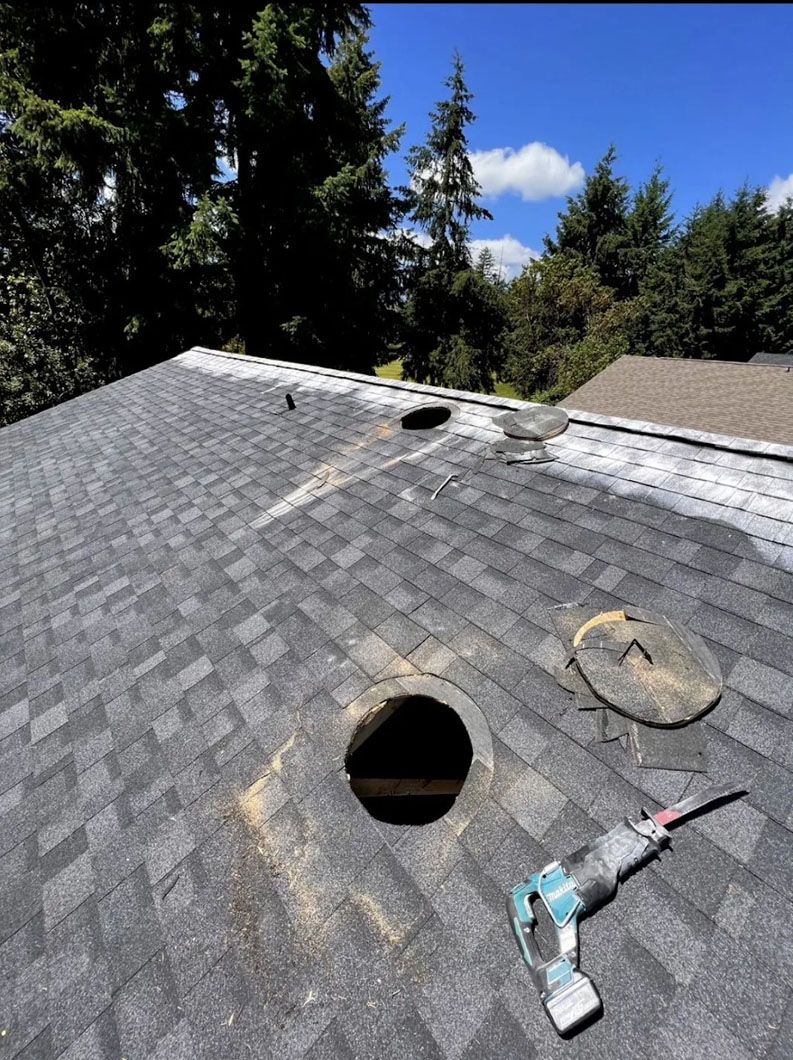 A roof with a hole in it and a tool on it.
