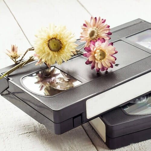 A vhs tape with flowers on top of it
