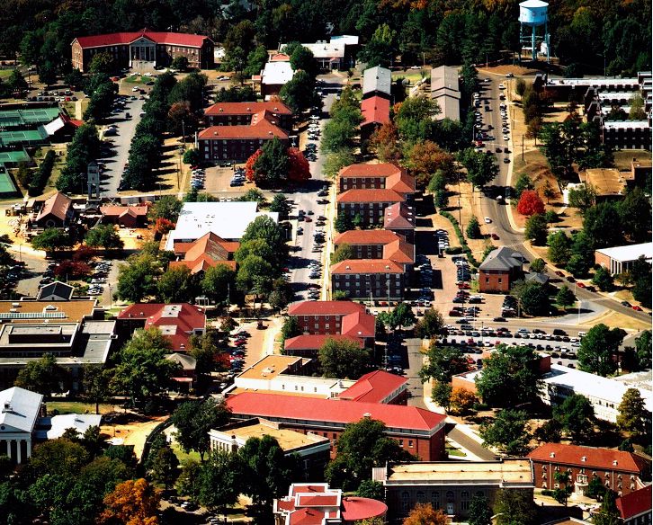 An aerial view of a city with lots of buildings and trees