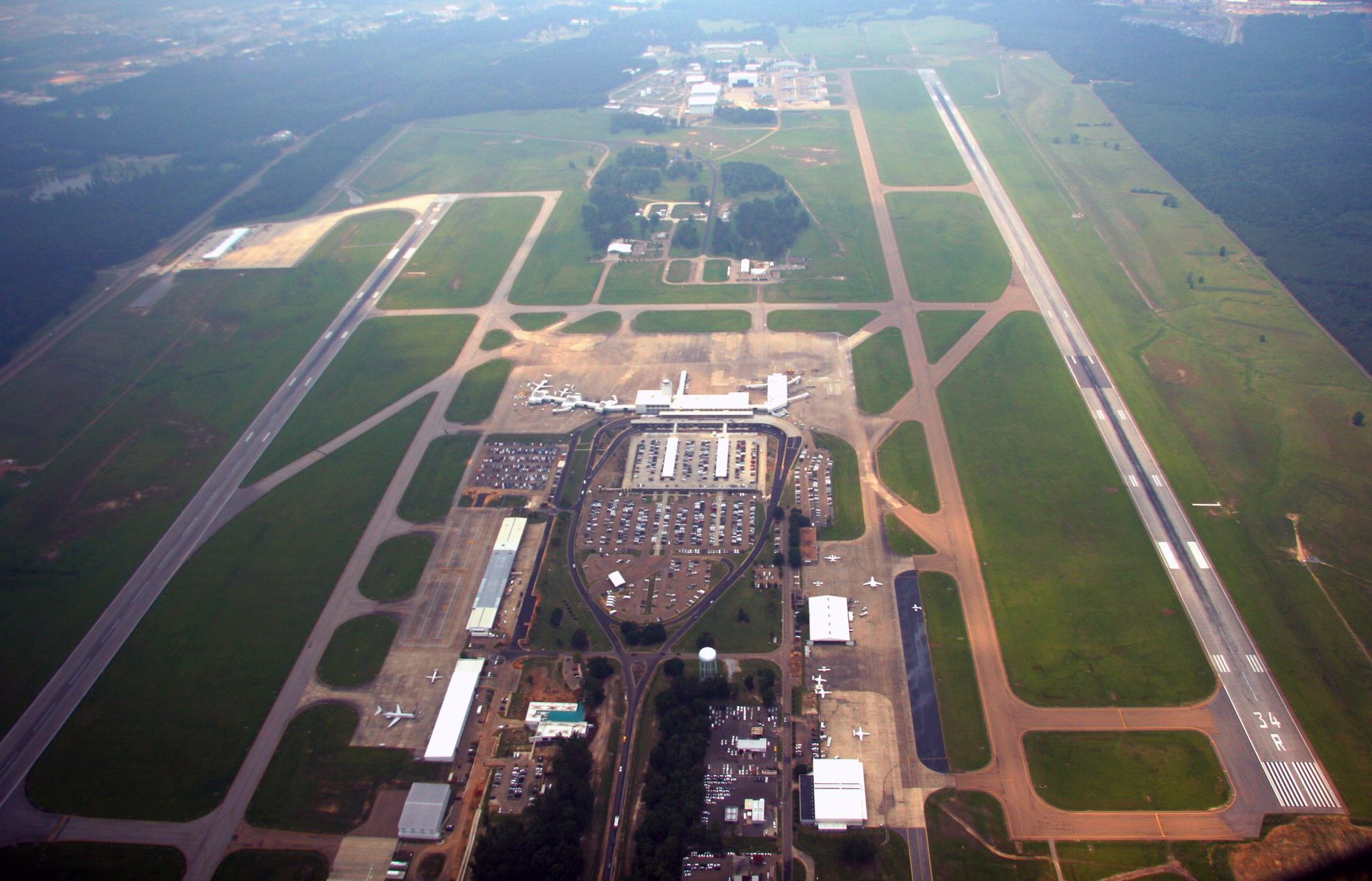 An aerial view of a large airport with lots of runways