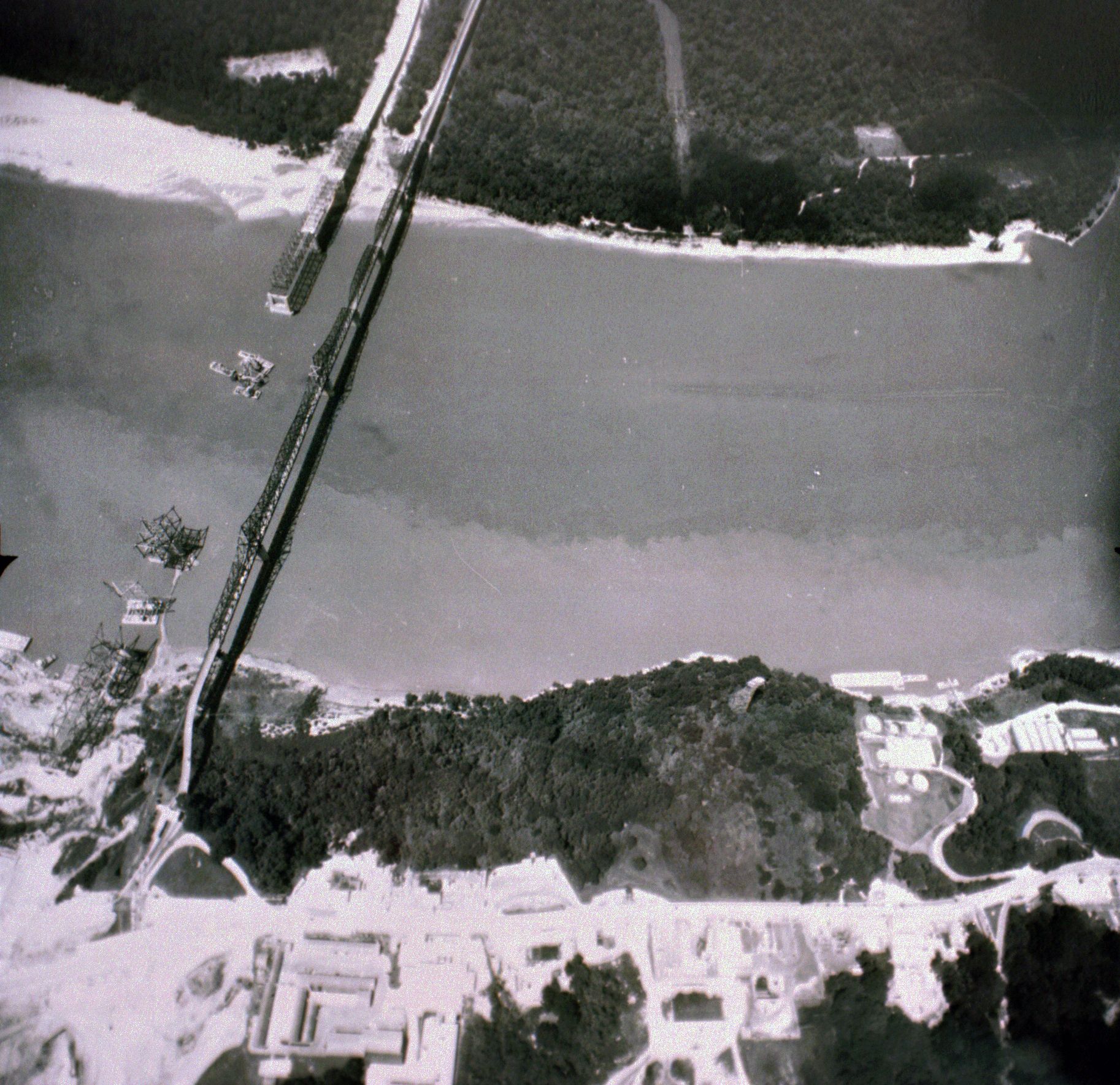 An aerial view of a bridge over a body of water