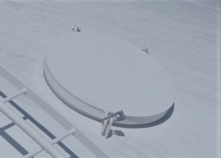 An aerial view of a circular object in the snow