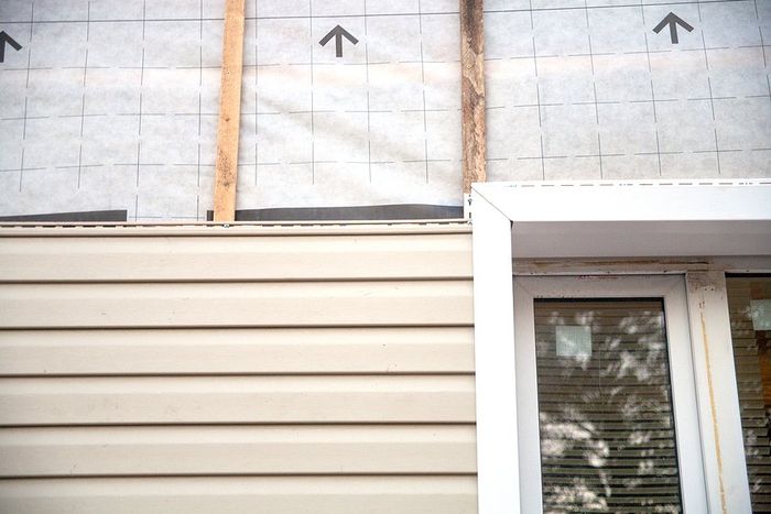 siding being installed on a house